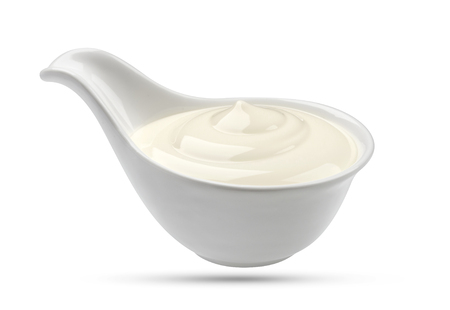 Sour cream in bowl isolated on white background with clipping pathの写真素材