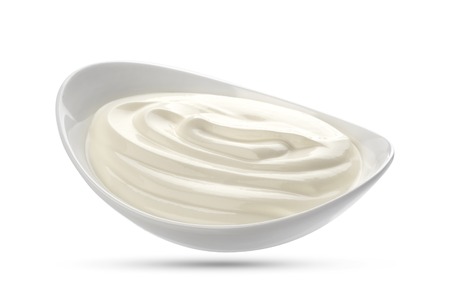 Sour cream in bowl isolated on white background with clipping pathの写真素材