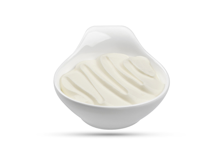 Sour cream in bowl isolated on white background with clipping pathの写真素材