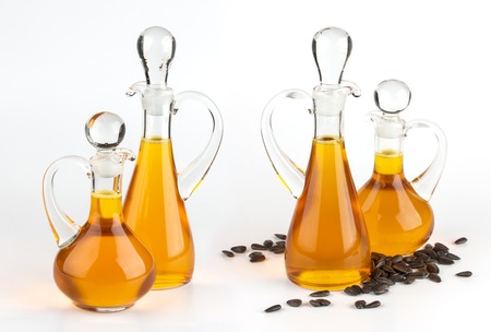 Sunflower oil glass bottle isolated on white backgroundの写真素材