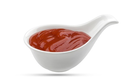 Ketchup in bowl isolated on white background. Portion of tomato sauce. With clipping path.の写真素材