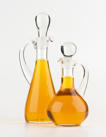Vegetable oil glass bottle isolated on white backgroundの写真素材