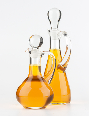 Vegetable oil glass bottle isolated on white backgroundの写真素材