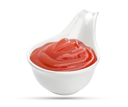 Ketchup in bowl isolated on white background. Portion of red tomato sauce. With clipping path.の写真素材