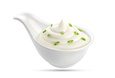 Sour cream with onion in a bowl isolated on white background, with clipping path.の写真素材