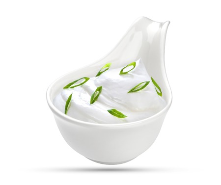 Bowl of sour cream isolated on whiteの写真素材