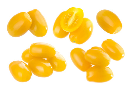 Heap of orange cherry tomatoes isolated on white backgroundの写真素材