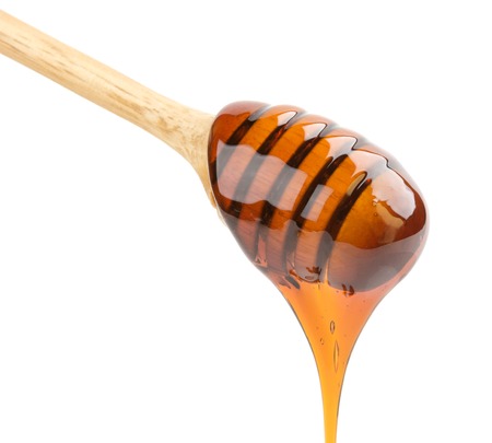 Honey stick isolated on whiteの写真素材