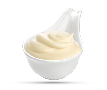 Mayonnaise sauce in bowl isolated on whiteの写真素材