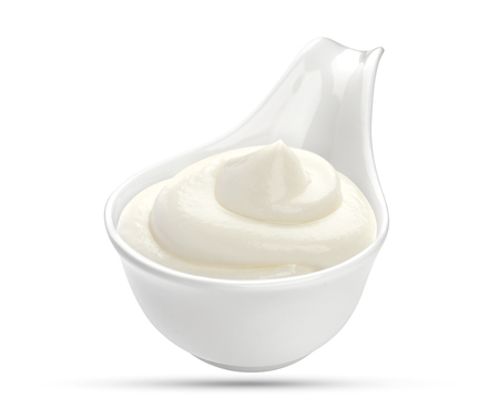 Sour cream in bowl isolated on white backgroundの写真素材