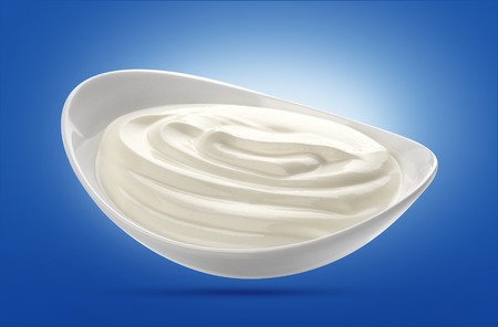 Sour cream in white bowl isolatedの写真素材