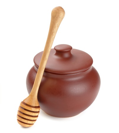 Honey pot isolated on white backgroundの写真素材
