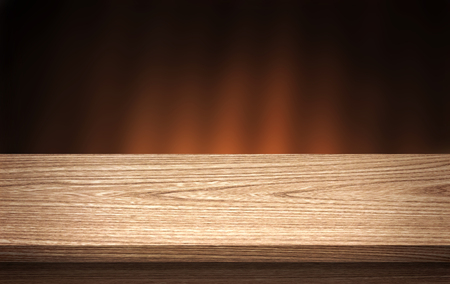 Wood background table. Empty wood table top and blur in dark night background. For montage product displayの写真素材