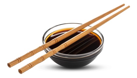 Soy sauce and chopsticks isolated on white background, with clipping pathの写真素材