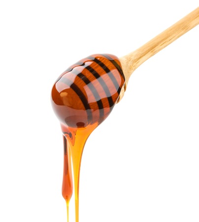 Honey stick isolated on white, with clipping pathの写真素材