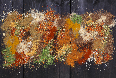 Various spices on wooden background. Top view with copy spaceの写真素材