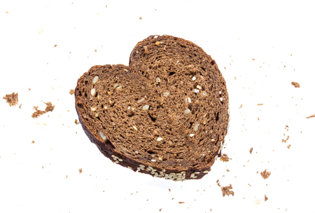 Heart made from bread on white backgroundの写真素材