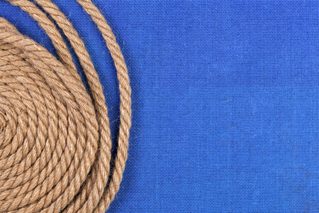 Ship rope on blue background, top view with copy spaceの写真素材