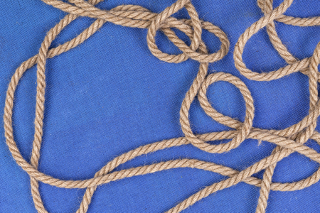 Ship rope on blue background, top view with copy spaceの写真素材