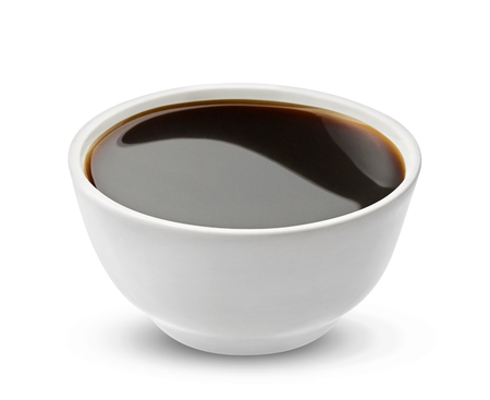 Soy sauce in bowl isolated on white background, with clipping path, one of the collection of various saucesの写真素材