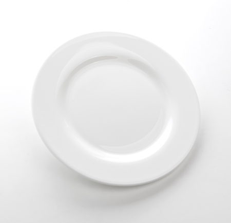 White plate isolated on white table, empty dish templateの写真素材