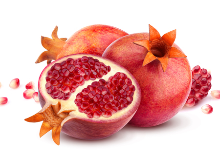 Group of pomegranate fruits isolated on white background, composition with pomegranate seedsの写真素材