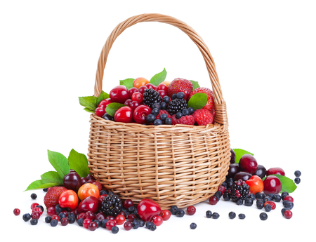 Fresh berries in basket isolated on white backgroundの写真素材