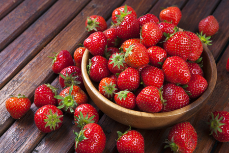 Strawberries on wooden background. Copy spaceの写真素材