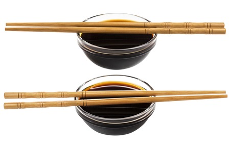 Glass bowl of soy sauce isolated on white backgroundの写真素材