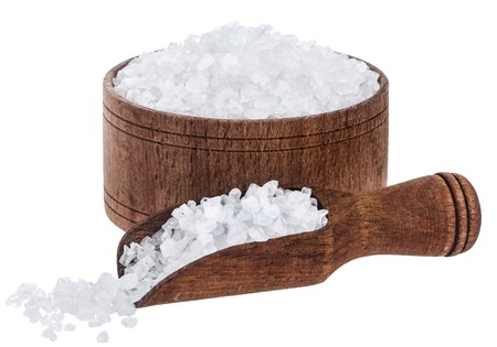 Sea salt in wooden bowl and scoop isolated on white background closeup, top viewの写真素材