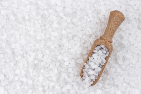 Sea salt background with wooden scoopの写真素材