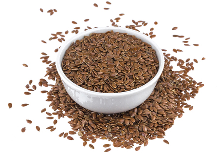 Cumin or caraway seeds in small bowl isolated on white backgroundの写真素材