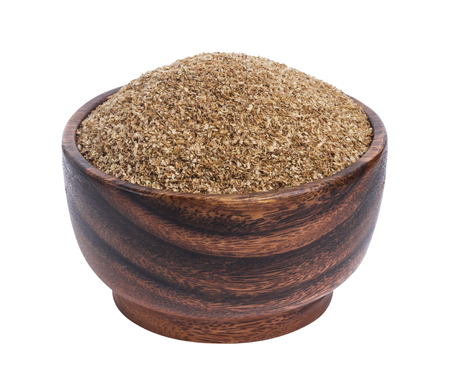 Fiber food. Dry ground fiber in bowl isolated on white backgroundの写真素材