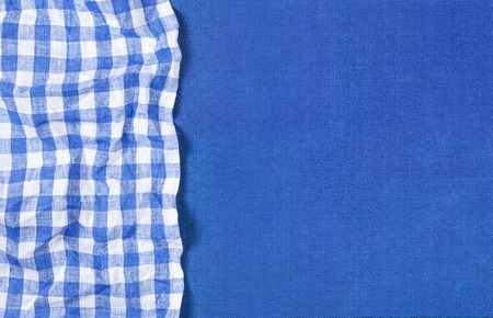 Blue canvas texture with blue checkered napkin for product presentation, top viewの写真素材