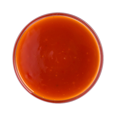 Hot chilli sauce in bowl isolated on white background. Top viewの写真素材