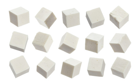 Greek feta cubes. Diced soft cheese isolated on white backgroundの写真素材