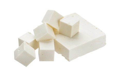 Heap of diced feta cubes isolated on white backgroundの写真素材