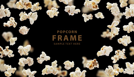 Popcorn frame, flying popcorn isolated on black background with copy space, movie poster conceptの写真素材