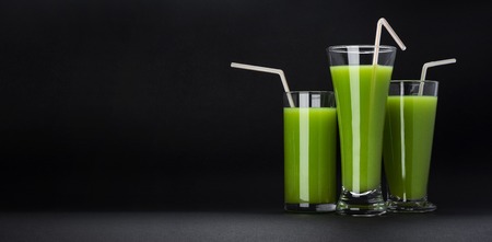 Green smoothie isolated on black background with copy spaceの写真素材