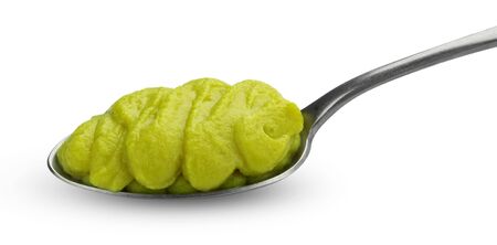 Green vegetable puree for baby food in spoon isolated on white background with clipping pathの写真素材