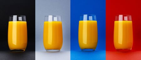 Glass of orange juice isolated on different color backgrounds, fresh citrus juice, orange cocktail, healthy drink concept, close-upの写真素材