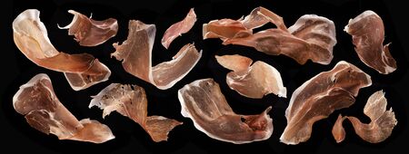 Sliced jamon, dry italian prosciutto crudo, spanish ham on black backgroundの写真素材
