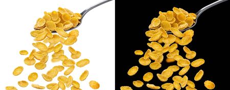 Corn flakes with spoon isolated on white and black backgrounds