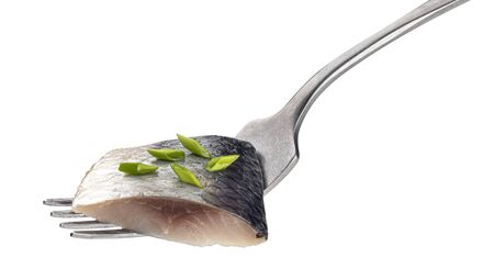 Pieces of salted herring on fork isolated on white backgroundの写真素材