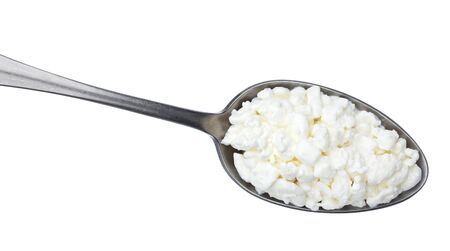 Spoon of cottage cheese isolated on white background, top viewの写真素材