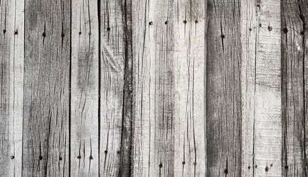 Wooden rustic grey planks texture vertical background. Scratched old wood wall backdrop. Shabby...