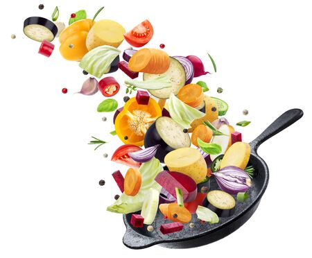 Different vegetables falling into frying pan isolated on white background, mix of sliced flying food ingredientsの写真素材