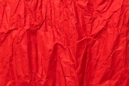 Red crumpled paper texture, grunge backgroundの写真素材