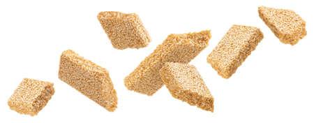 Falling sesame kozinaki isolated on white backgroundの写真素材