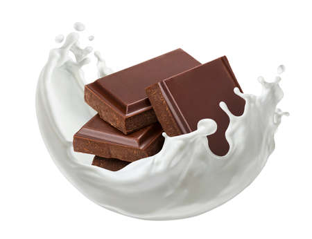 Pieces of chocolate bar with milk splash isolated on white backgroundの写真素材